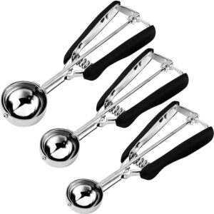 Set of three stainless steel ice cream scoops with black rubber handles, arranged diagonally on a white background.