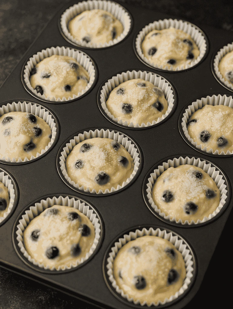 Filled muffin tray ready for baking