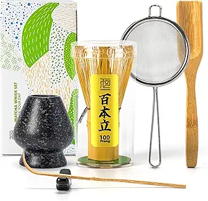 Complete Japanese matcha whisk set including bamboo whisk (chasen), whisk holder, scoop, tea sifter, and traditional matcha tools arranged neatly with packaging in the background.