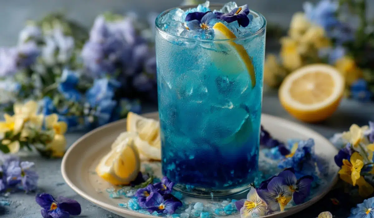 Does the Blue Salt Trick Really Work? A dramatic glass of glowing blue water with salt crystals on a gray kitchen countertop. A dramatic glass of glowing blue water with salt crystals on a gray kitchen countertop.