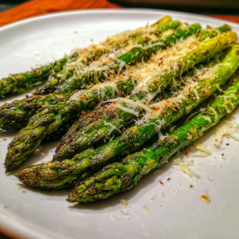 A vibrant platter of perfectly roasted asparagus with parmesan, golden and tender, ready to be served as a delicious side dish.